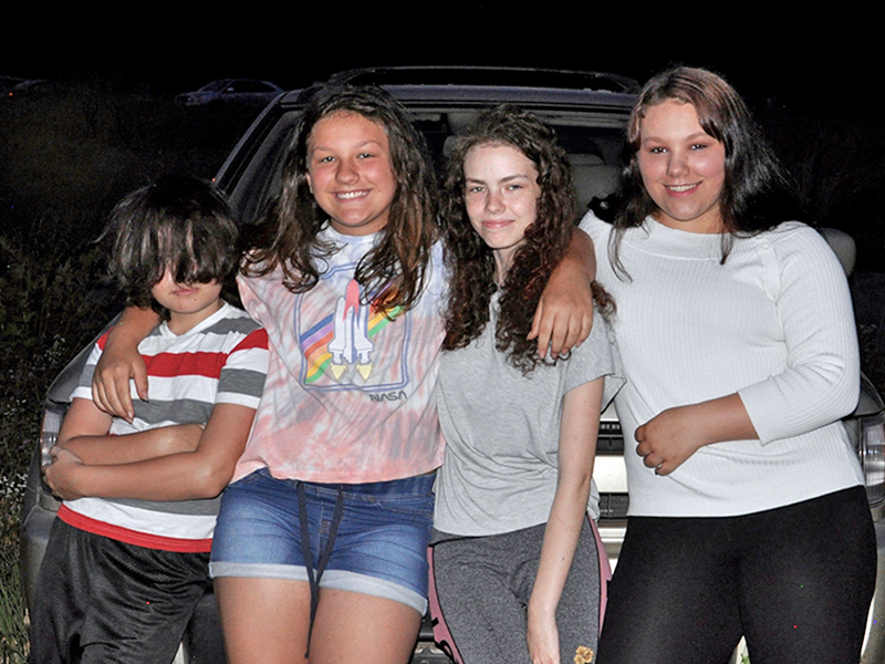People gathered and waited for McCaysville’s fireworks show to light up the sky Friday, July 3. Shown are, from left, Trent Stuart, Seanna Allen, Trinity Stuart and Hannah Allen.