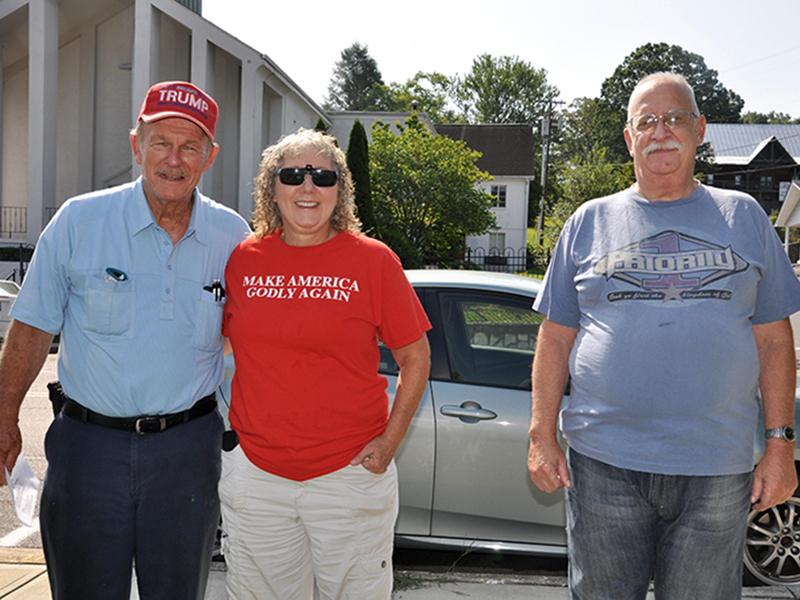 Community members met Saturday morning, July 18, for a prayer rally hosted by the Mountain Patriots. Shown are, from left, Lane and Shelley Bishop and Bob Myers.