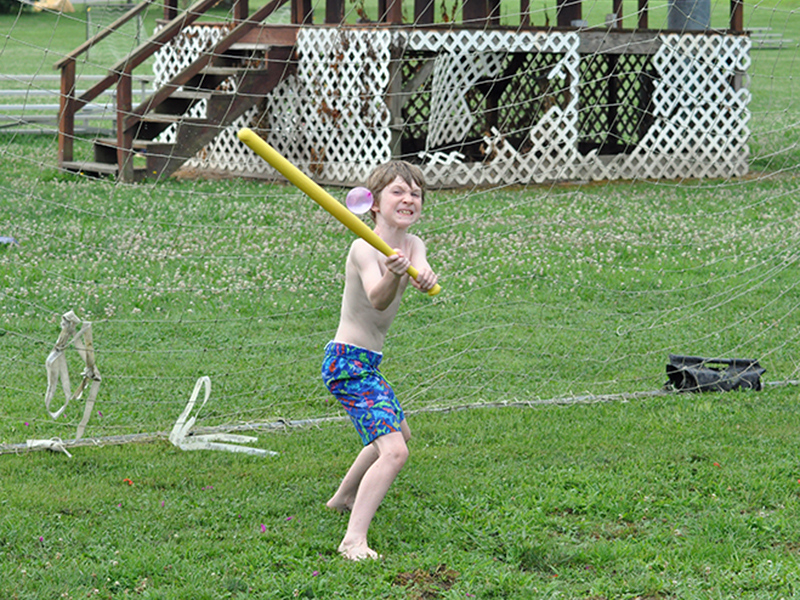 Wyatt Turpin crushes a water ballon during the Fannin Recreation Center’s summer camp, Wednesday, July 8.