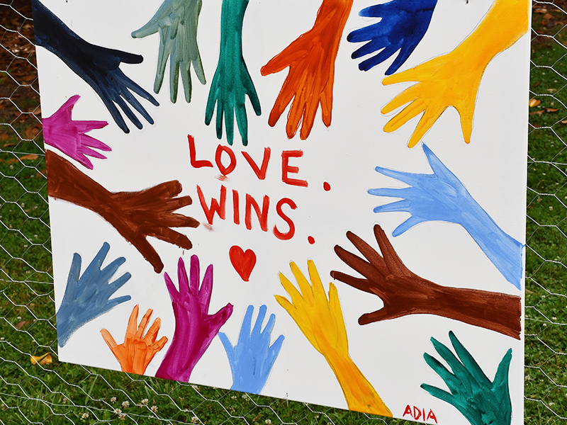 Artwork sharing the message, “Love wins” was displayed at the Silent Rally for Respect, Peace, and an Equitable Future for All in the downtown Blue Ridge city park Monday, July 6.
