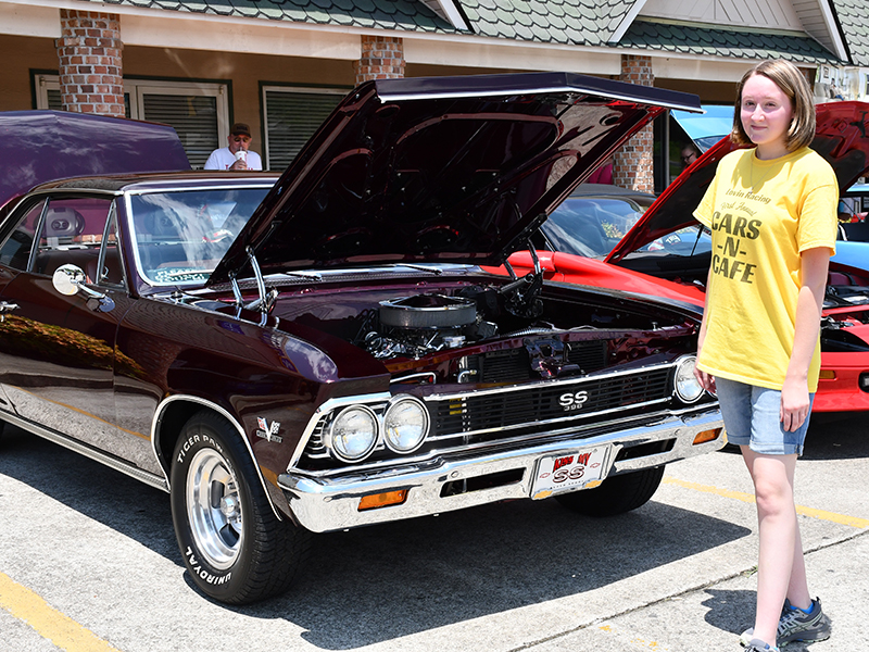 Shelby Pierce of Lovin Racing explored different cars at the Cars for a Cause car show fundraiser hosted by Lovin Racing and Circuit World to benefit Fannin County Family Connection Sunday, July 19.