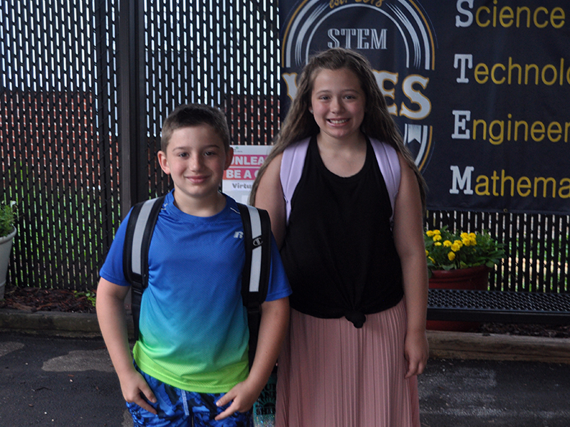 James Conner Reddit and Lyla Ann Strange smile as they walk into West Fannin Elementary School to begin the 2020-2021 school year.