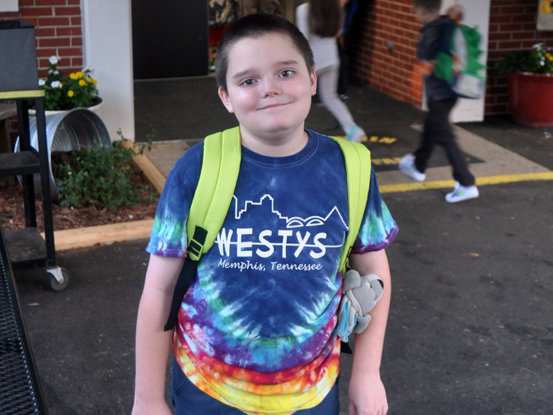Fourth grader Patrick Thomas is all smiles as he walks to class during the first day of in-person school at West Fannin Elementary School since March.