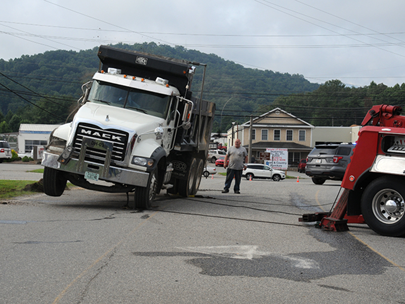 After landing on its wheels, the dump truck made quite a bounce before it came to rest.
