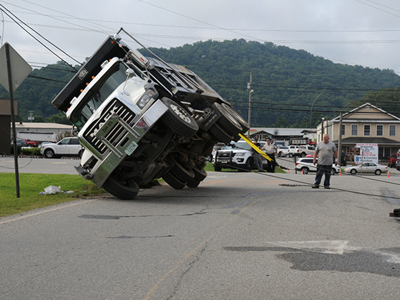 Righting the dump truck was no easy task and took Fannin Wrecker crews about an hour.