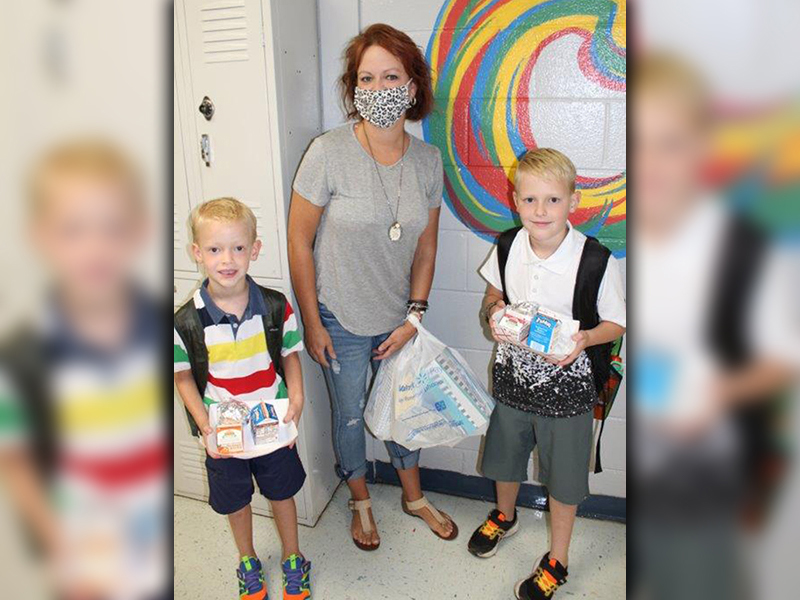 East Fannin Elementary School kiddos and their parents excitedly returned to school, Friday, August 7, for the first time since COVID-19 necessitated school closures in March. Shown are Cord Cochran, Kristy Cochran and Ty Cochran.