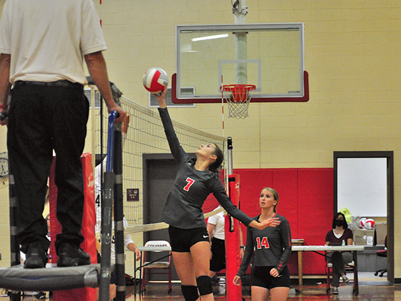 Lady Cougar Albani Dotson tips the ball over the net during Copper Basin’s match with Tellico Monday, August 24.