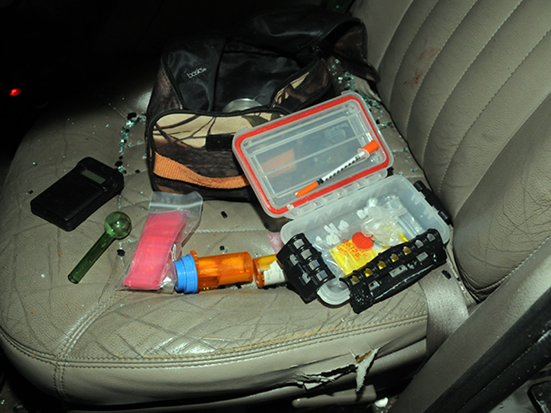 Some of the drugs and related objects taken from the Martell vehicle.