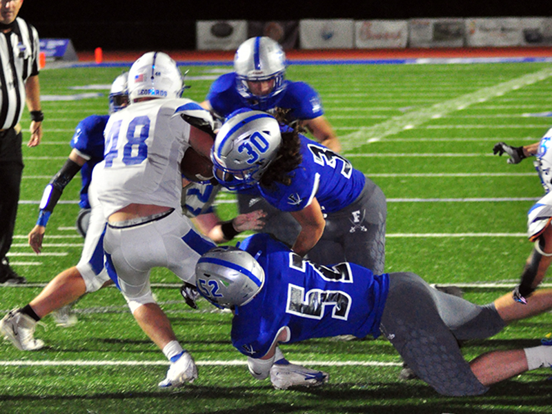 Fannin Rebels Andrew Waldrep (30) and Micah O’Neal (52) bring down a Banks County ball carrier Friday, October 2.
