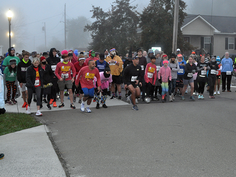 Runners take off at the start of the Bigfoot Boogie 5K Saturday, October 31. The 5K went through McCaysville and Copperhill, before ending in McCaysville City Park.