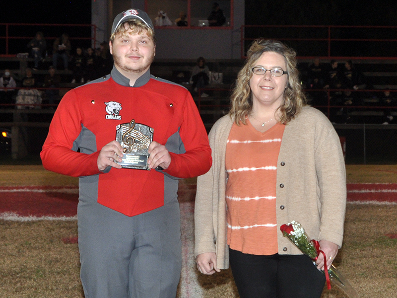 Copper Basin High School honored their golf, band, cheerleaders and football seniors Friday, November 6, at the Cougars home playoff game against Clay County. Band senior Adam Ferguson is shown escorted by Alison Arp.