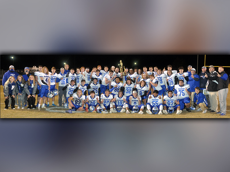 The Fannin County football squad shows off their region championship trophy after their 55-7 win over Dade County Friday, November 20. The title came from the Rebels' perfect 8-0 overall record and 5-0 region mark this season. Please see B1 for complete coverage of the Dade County contest.