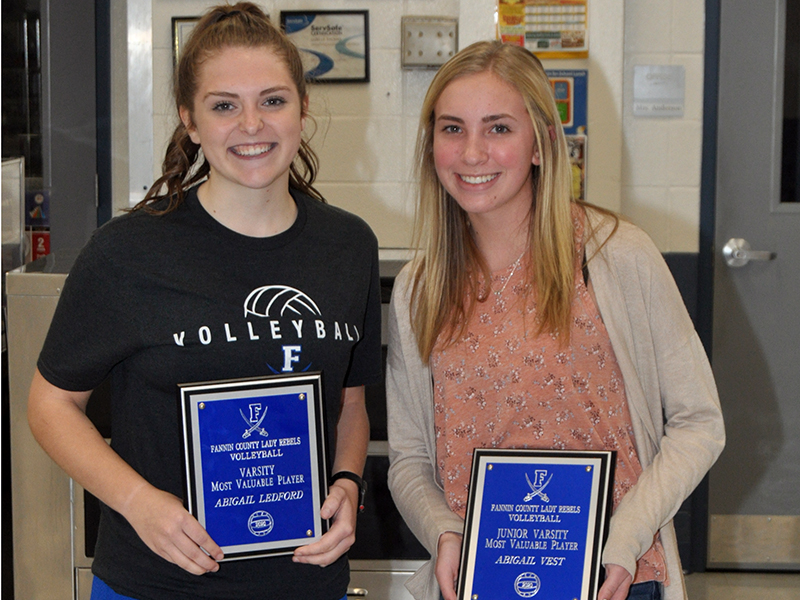 Varsity Lady Rebel Abby Ledford, left, and Junior Varsity Lady Rebel Abigail Vest won the Lady Rebel Most Valuable Player Award at the Lady Rebel volleyball banquet Tuesday, November 10.