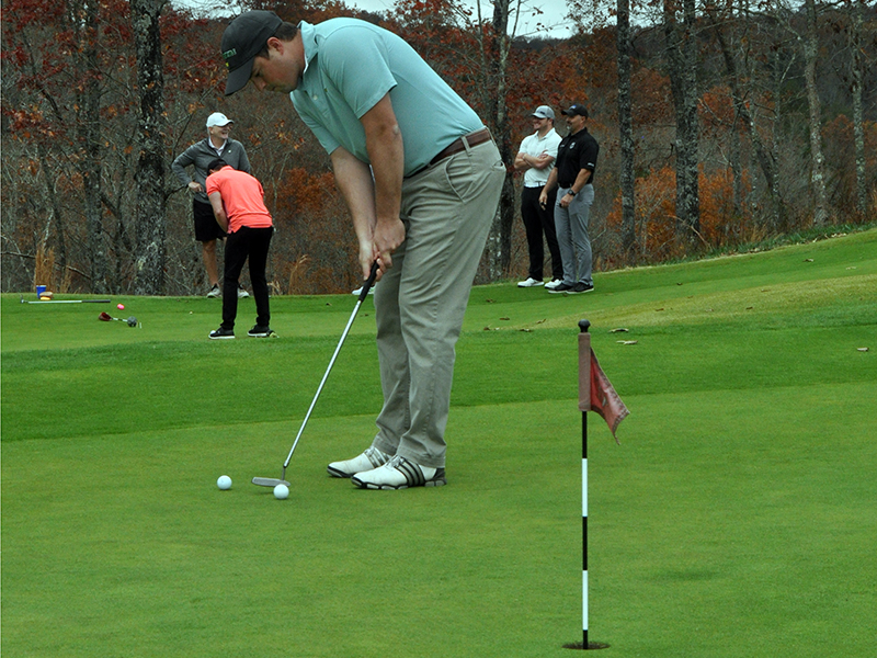 Matthew Yonz practices his putting just before tee time at the Blue Ridge Classic Scramble Tuesday, November 10. The tournament was a benefit for Blue Ridge Police Chief Johnny Scearce.