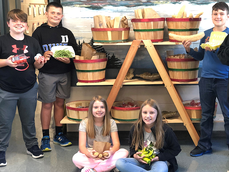 Blue Ridge Elementary School students show off produce for sale at the school’s new Bears Farm and Arts Mini Famer’s Market. Shown are, from left, Drew Dyer, Reed Holloway, Laurel Minear, Adalyn Stanley and Alex Cruse.