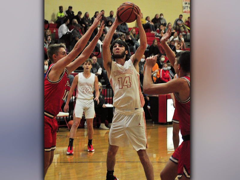 Copper Basin Cougar Logan Burkett puts up a shot during the Cougars game against Polk County Thursday, December 3.