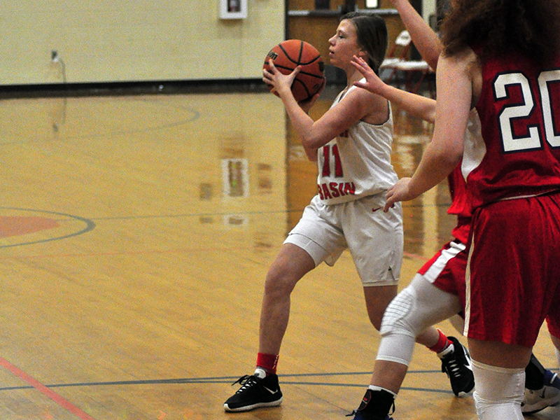 Lady Cougar Summer Montgomery passes to the open player during the Lady Cougars game against Polk County Thursday, December 3.