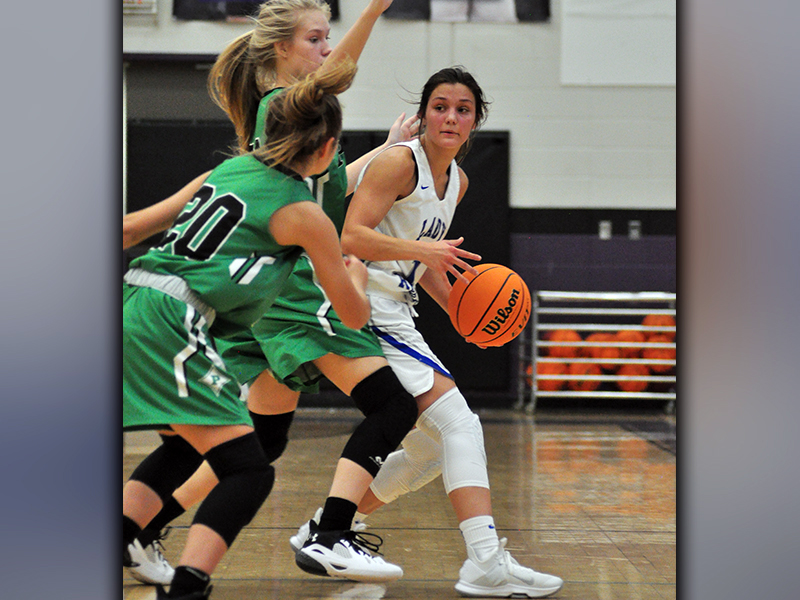 Lady Rebel Becca Ledford fights through a double team in recent action for the Fannin County Lady Rebel basketball team.