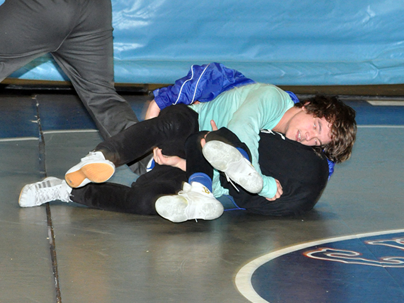 Fannin wrestler Corbin Davenport works to pin his opponent during the Rebels wrestling practice Wednesday, December 16.