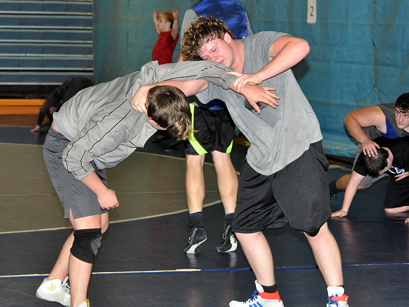 RIGHT: Matthew Crowder, left, and Jesse Daveport work on technique during the Fannin County High School Rebels wrestling practice Wednesday, December 16.