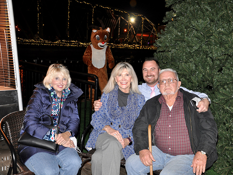 McCaysville City Council Members Gilita Carter and Susan Kiker, McCaysville Police Chief Michael Earley and Mayor Thomas Seabolt, from left, were present to ring in some Christmas cheer during Light Up McCaysville.