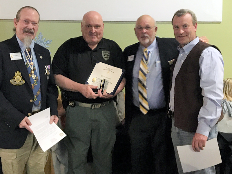 The Blue Ridge Mountains Chapter of the Sons of the American Revolution awarded a medal Sergeant J.K. Davenport of the Fannin County Sheriff’s Office.    Shown are, from left,  SAR Vice President Sid Turner, Davenport, SAR President Jared Ogden and Fannin County Sheriff Dane Kirby.