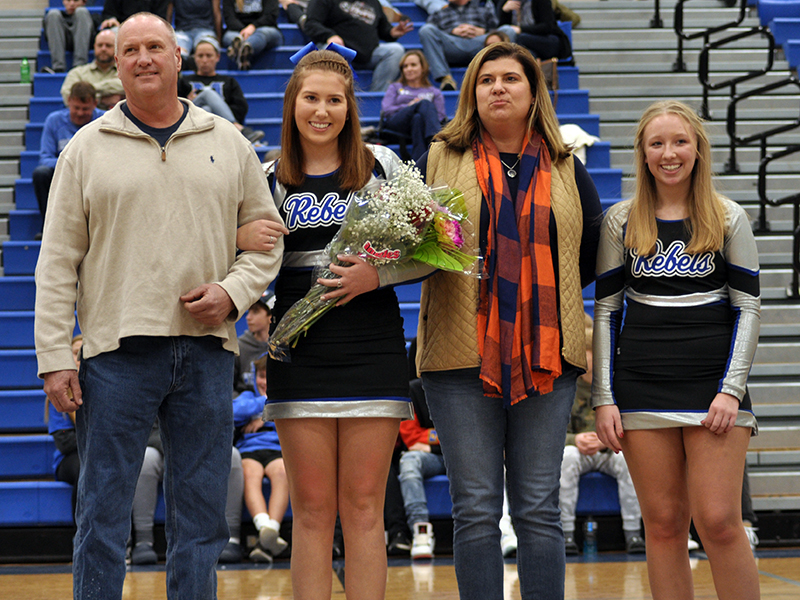 Fannin County High School cheerleading senior Cady Finley was honored along with the other cheer and basketball seniors at FCHS senior night ceremony Friday, January 15. Shown during the ceremony are, from left, father, Philip Finley; Finley; mother, Heather Finley; and Lexi Long.