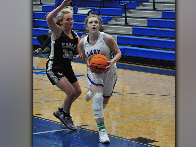 Abby Ledford gets past a Coosa Lady Eagle for a two-point basket during the Lady Rebels 74-21 win over the Lady Eagles Friday, January 22.