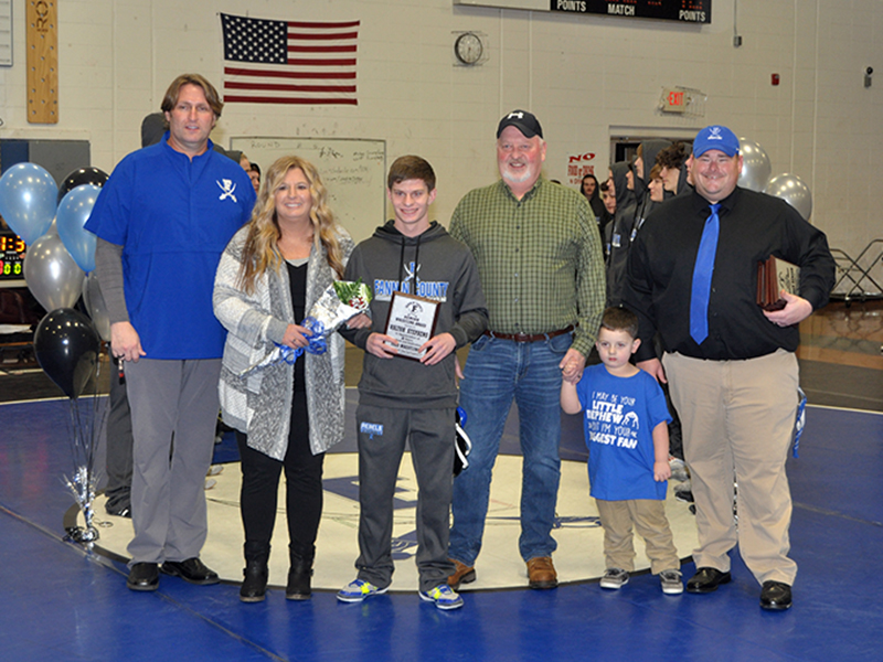 Kolton Stephens was one of seven seniors honored at Fannin County High School wrestling senior night Friday, January 15. Shown during the ceremony are, from left, Coach Alan Collis, mother, Robin Stephens, Stephens, father, John Stephens, nephew, Anderson Cheek, and Coach Chuck Patterson.