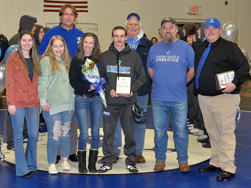 Fannin senior Kainan Henson was honored before the Rebels Area Duals Friday, January 15. shown during the ceremony are, from left, sister, Kirstie Henson, Avery Henson, Coach Alan Collis, mother, Mary Henson, Henson, grandfather, Mike Henson, father, Mark Henson, and Coach Chuck Patterson.