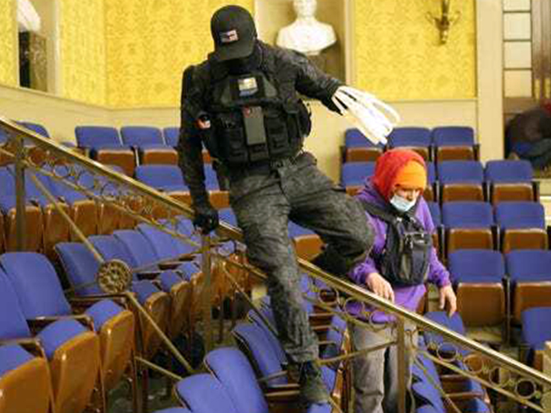 This photo of an individual, referred to on the internet as the “zip tie guy,” taken inside the Senate’s Chamber dressed in paramilitary gear and holding zip ties is believed to be Eric Gavelek Munchel, a 2009 graduate of Fannin County High School.