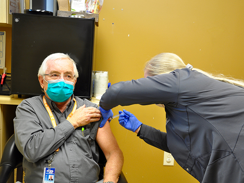 Georgia Mountains Health Chief Executive Officer Steven Miracle couldn’t be more excited to recieve his first dose of the Moderna COVID-19 vaccine Wednesday, December 23. Nurse Kiersten Lanier is shown administering the vaccine.