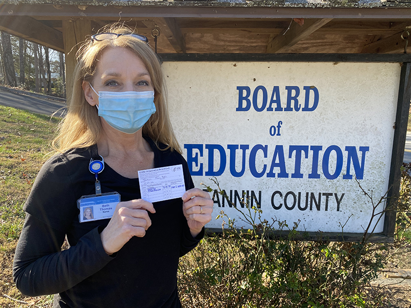 East Fannin Elementary School Nurse Beth Thomas proudly holds her COVID-19 Vaccination Record Card indicating that she’s received the first dose of the Moderna COVID-19 vaccine. “We have both done very well after receiving it,” Thomas said of the vaccine.