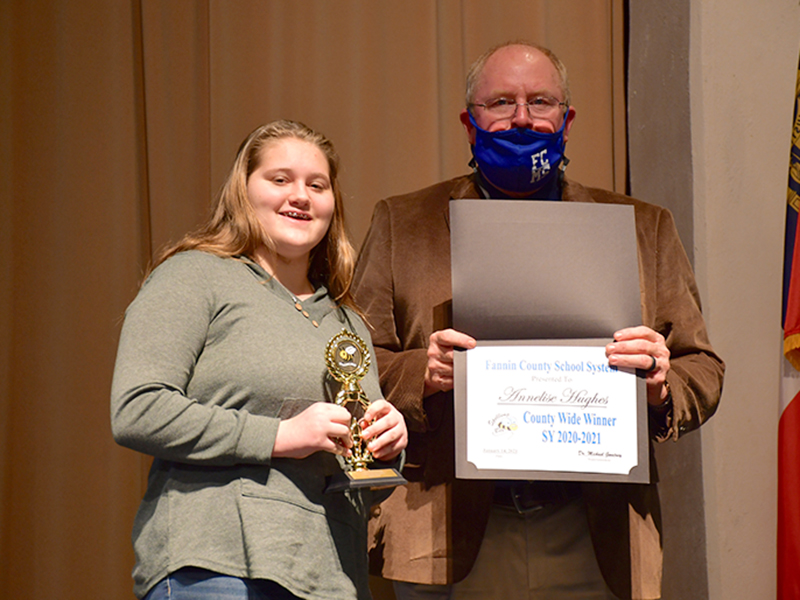Fannin County Middle School student Annelise Hughes ended the Fannin County School System District Spelling Bee as the winner after spelling the winning word, “Etruscan,” correctly Thursday, January 14. She will now move on to the region level. She is joined by Principal Keith Nuckolls.