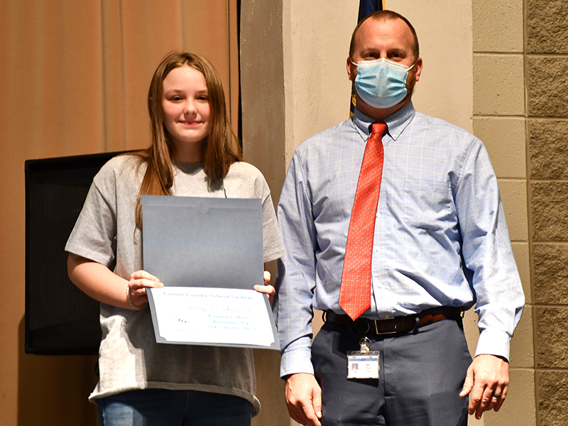 East Fannin Elementary School student Addelyn Barnes made it through several rounds of the Fannin County School System District Spelling Bee and was the first student to become a finalist before becoming the first runner-up Thursday, January 14. She is shown with Principal Matt Price.