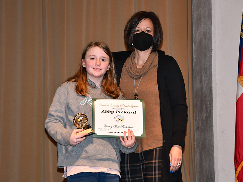 West Fannin Elementary School student Abby Pickard placed third in the Fannin County School System District Spelling Bee where she competed against students from East Fannin Elementary, Blue Ridge Elementary and Fannin County Middle School Thursday, January 14. She is shown with her principal, Alison Danner.