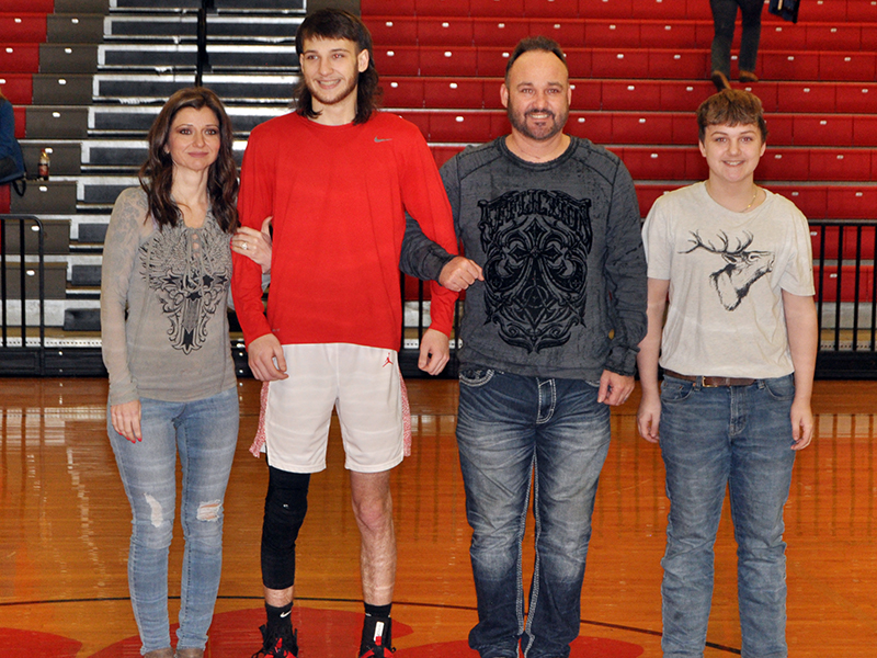 Copper Basin held its senior night ceremony for the basketball and cheer seniors Saturday, February 6. Shown during the ceremony are, from left, mother, Deanne Burkett; senior, Logan Burkett; father, Josh Burkett; and brother Joshua Burkett.