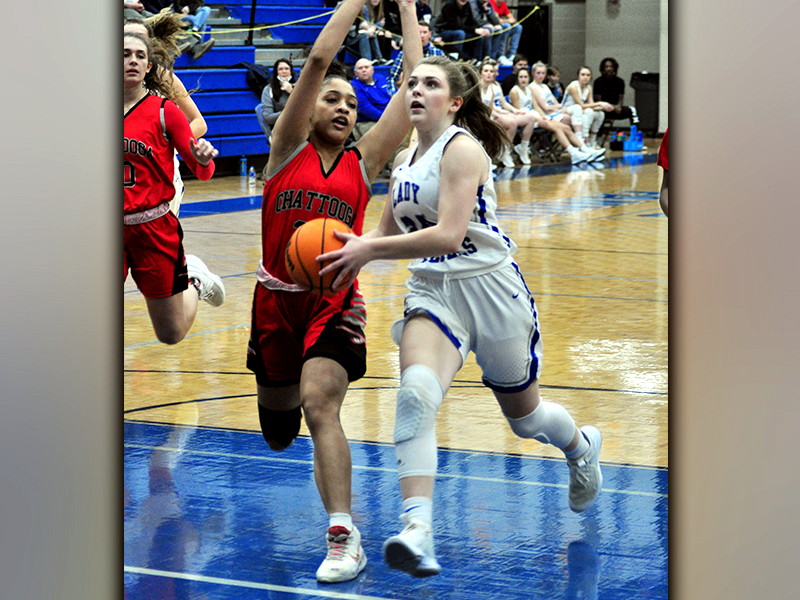 Abby Ledford gets past a defender in recent action for a two-point basket for the Lady Rebels.