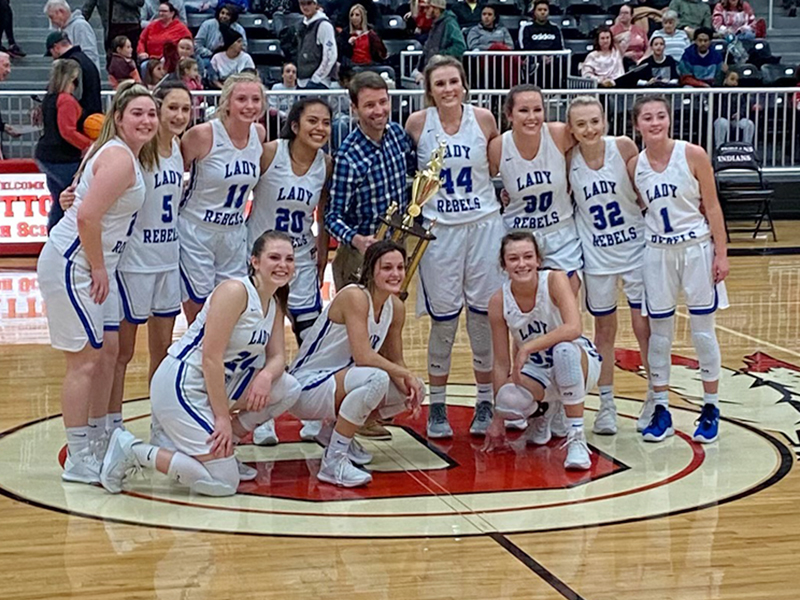 The Lady Rebels basketball team beat out Chattooga Thursday, February 18, to claim the AA Region 7 title. Shown following their championship victory are, from left, front, Abby Ledford, Becca Ledford and Reagan York; and back, Paige Foresman, Reigan O’Neal, Ava Queen, Prisila Bautista, Coach Ryan Chastain, Olivia Sisson, Natalie Thomas, Mackenzie Johnson and Courtney Davis.
