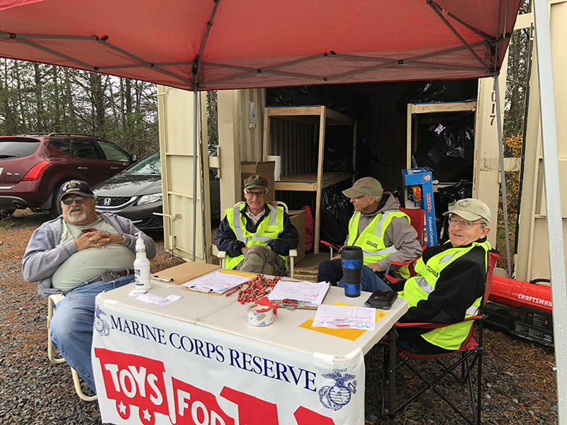 Members of the local Marine Corps League detachment work hard year-round to collect and distribute toys to various organizations and children in the community. Shown working Toys for Tots distribution are, from left, Greg Coffone, Dick Evelyn, Curt Jarrett and Jim Brumbelow.