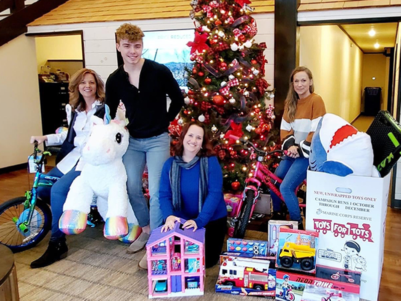 Harry Norman Realty collected and donated a variety of toys to the Marine Corps League’s annual Toys for Tots campaign this past holiday season. Shown are, from left, Joanne Wiley, Logan Fitts, Heather Gerald and Stephanie Cox.