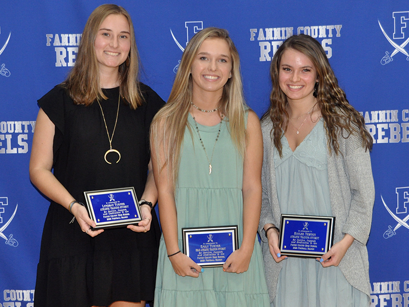 The Fannin County High School Athletic Trainers were honored at the Rebels’ football banquet Tuesday, March 16. Trainers shown are, from left, Lydnsay Turner, Emily Turner and Haylee Newton.