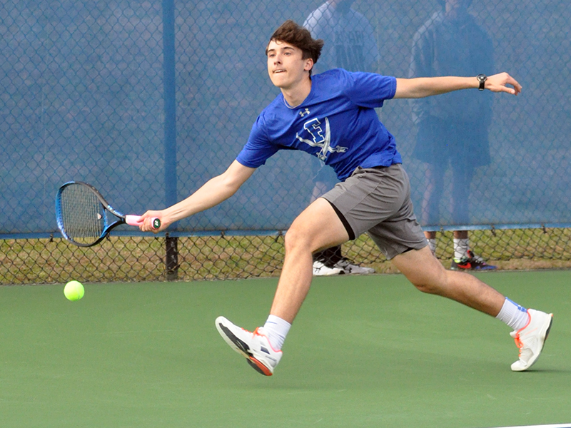 Jake Jones stretches out to keep a volley alive in recent action at a Fannin Rebel tennis match.