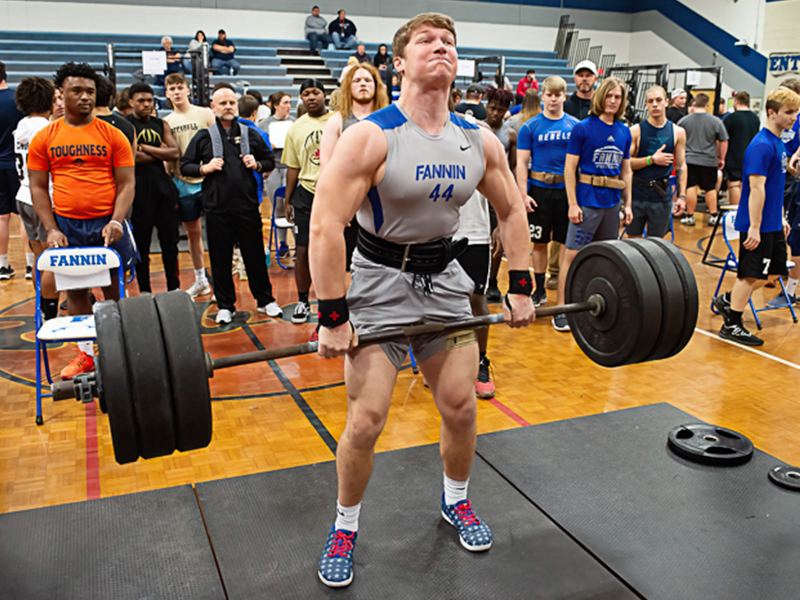 Fannin senior Micah O’Neal pulls a massive dead-lift in a recent weight lifting competition. O’Neal recently won the AA State Championship for weight lifting in the 225-pound classification.