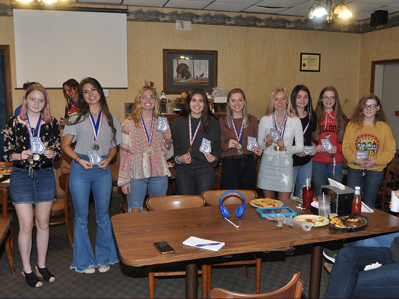 The Fannin County Lady Rebel cross country runners were award patches for their lettermen jackets for winning the Region 7AA Championship and placing sixth in the state. Shown following the presentation are, from left, Erin Jones, Monica Consentino, Kinsley Sullivan, Taylor Poland, Hannah Sosebee, Carlee Holloway, Kristin Cipich, Olivia Temples and Shaylee Jones. Not pictured, Teagan Cioffi.