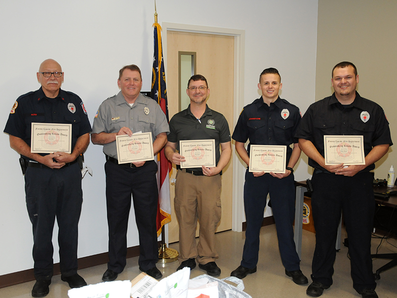 Rob Ross, Kevin Panter, Hugh Rogers, Channing Johnstone and Bradley Beaver, from left, received Outstanding Rescue Awards for their parts in saving the lives of two stabbing victims. It was that same incident that resulted in the "David W. Curtis Memorial Medic Award" for Mason Cruse and Ryan McDaris.