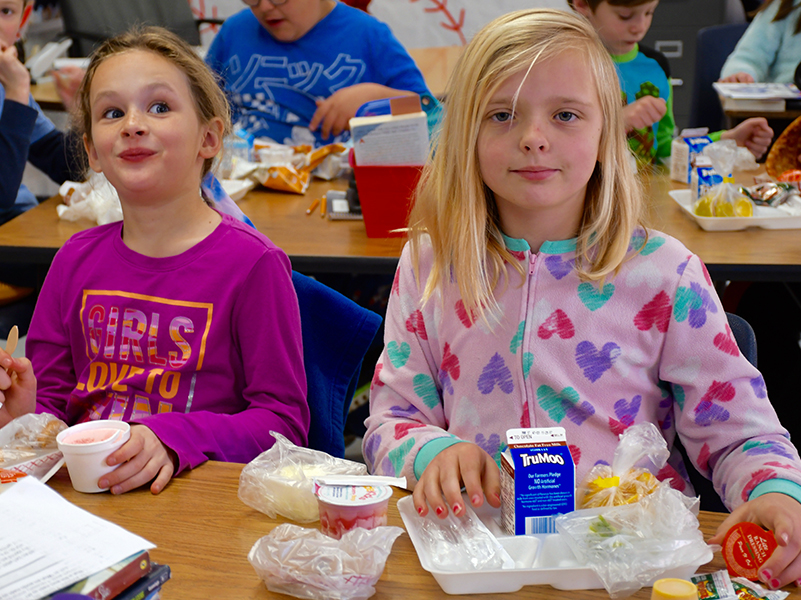 East Fannin Elementary School students Emery Collins and Lauren Hess took a quick lunch break during the school’s Read Across America Week Pajama Day.