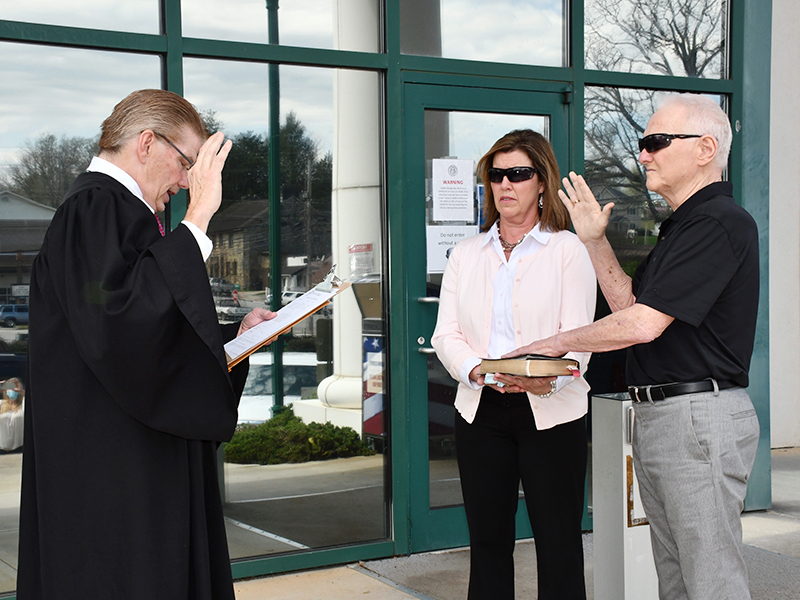 Johnny Scearce is officially Fannin County’s Post One Commissioner following his swearing-in ceremony on the front steps of the Fannin County Courthouse Friday, March 26. He is shown with his wife, Brenda, and Probate Court Judge Scott Kiker.