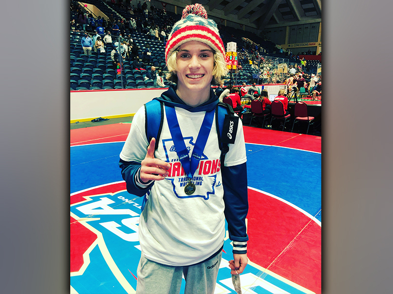Blake Summers is all smiles as he shows off his medal after he won the state title. Summers is the first freshman to win a wrestling state title at Fannin County High School.