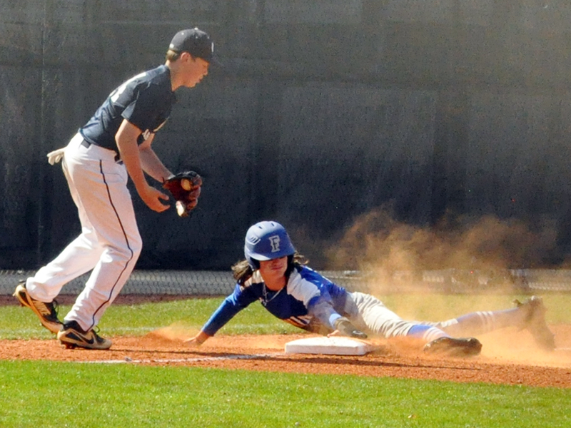 Colton Gray slides into third and later goes on to score in Fannin County Middle School’s baseball region championship against White County Tuesday, March 30.